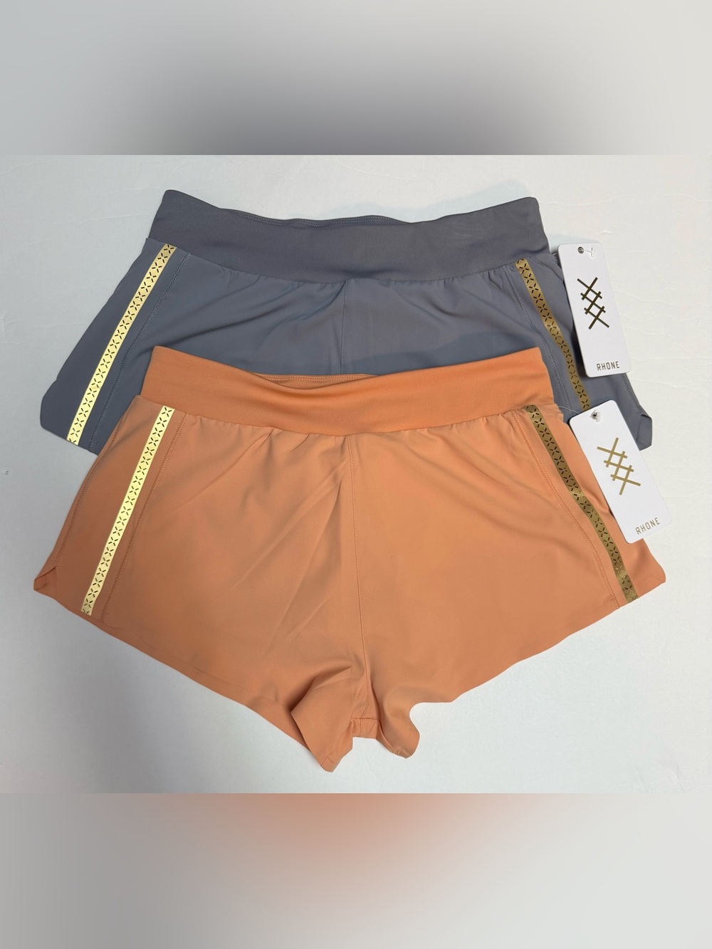 NWT 2 Rhône Women's peach and gray Athletic Shorts with Gold Side Stripe size S